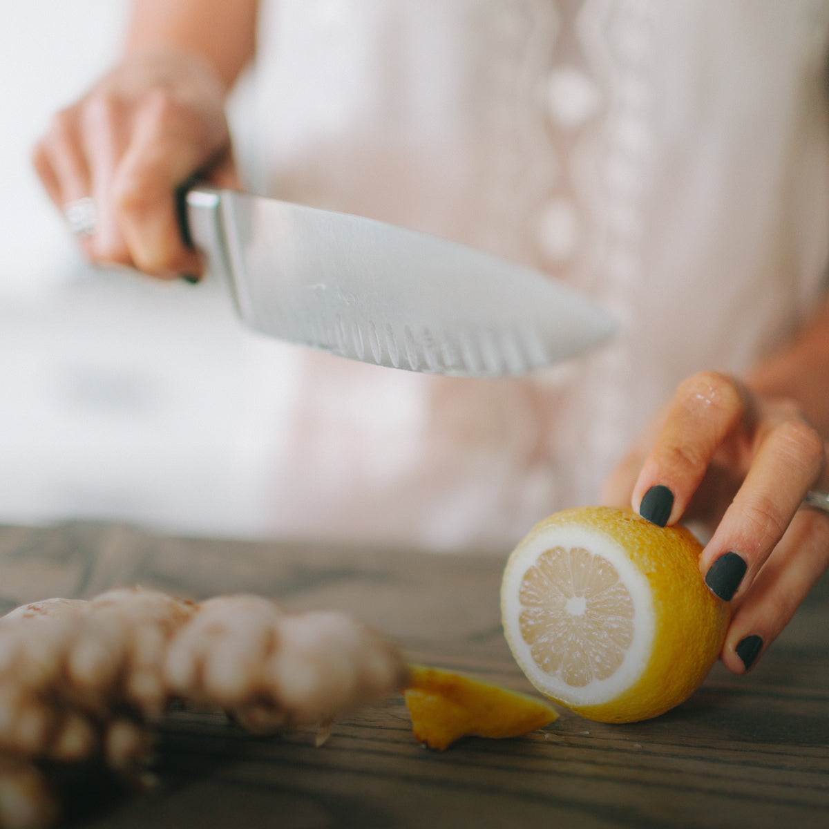 woman cutting lemon