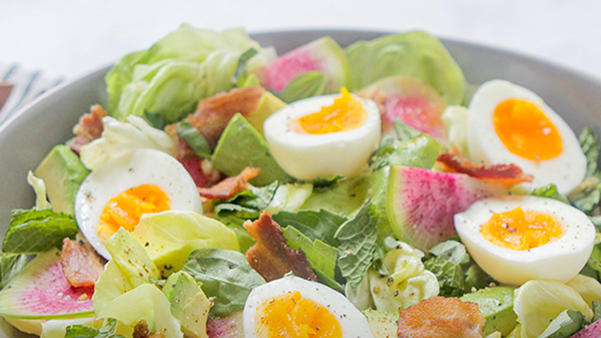 salad with eggs and bacon naturally nourished
